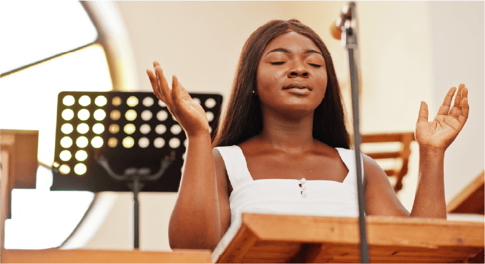 Young adult female hands up worshiping - picture